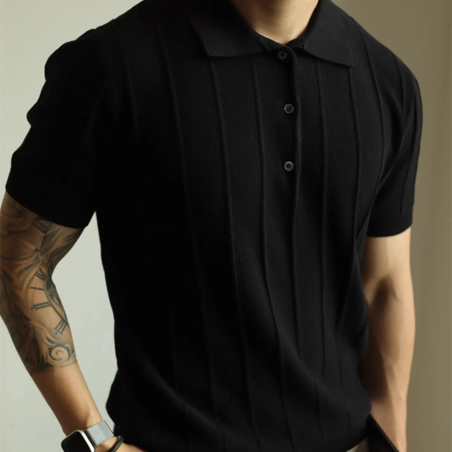 Model wearing Baltere's classic men's polo shirt, showcasing its relaxed fit and modern style.