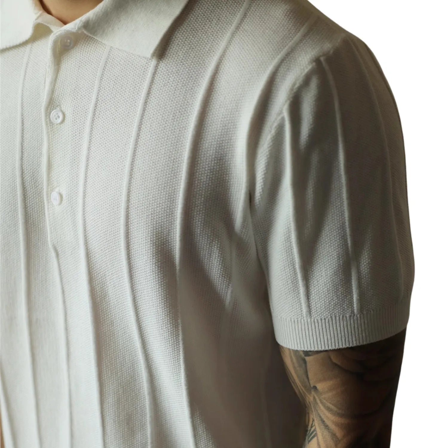Model wearing classic men's polo shirt, showcasing its relaxed fit and modern style.