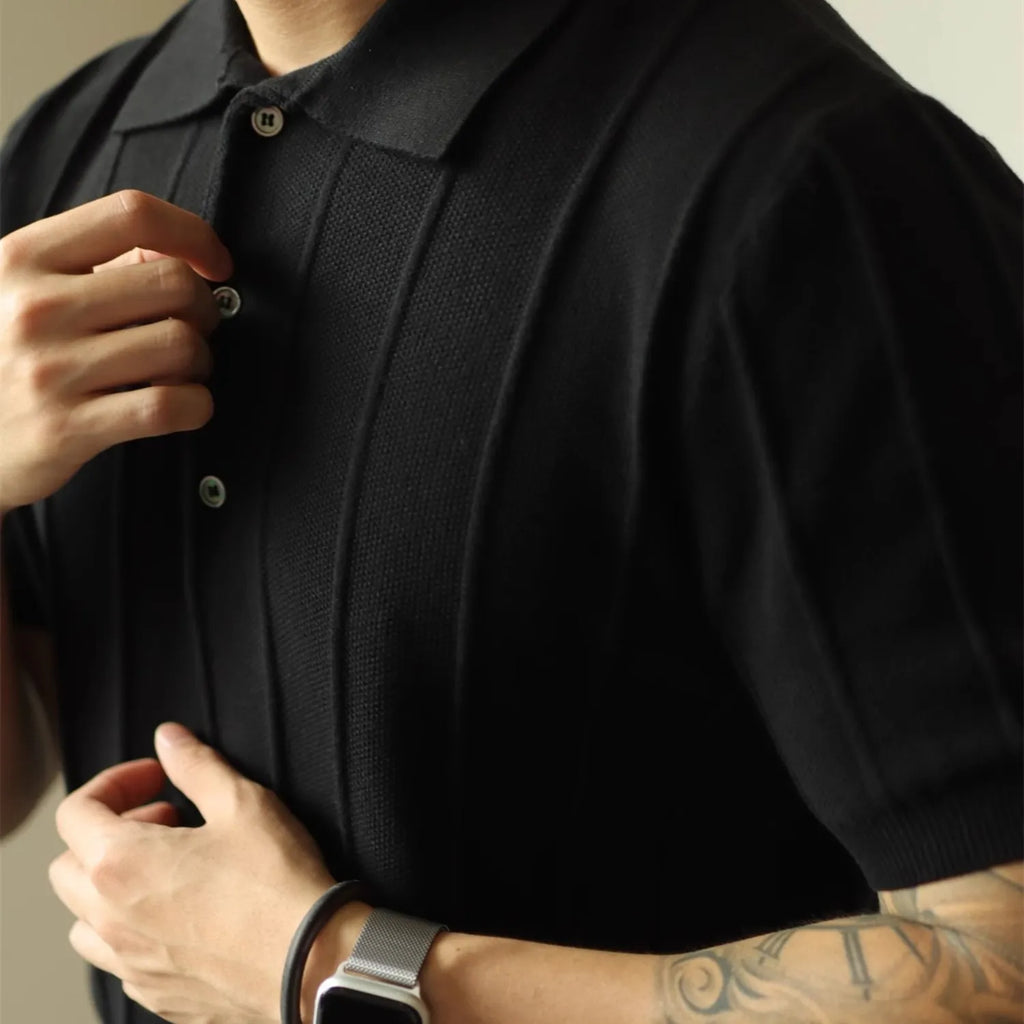 Model wearing Baltere's classic men's polo shirt, showcasing its relaxed fit and modern style.