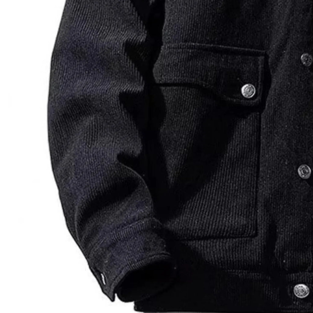 Close-up of the corduroy jacket's ribbed texture.
