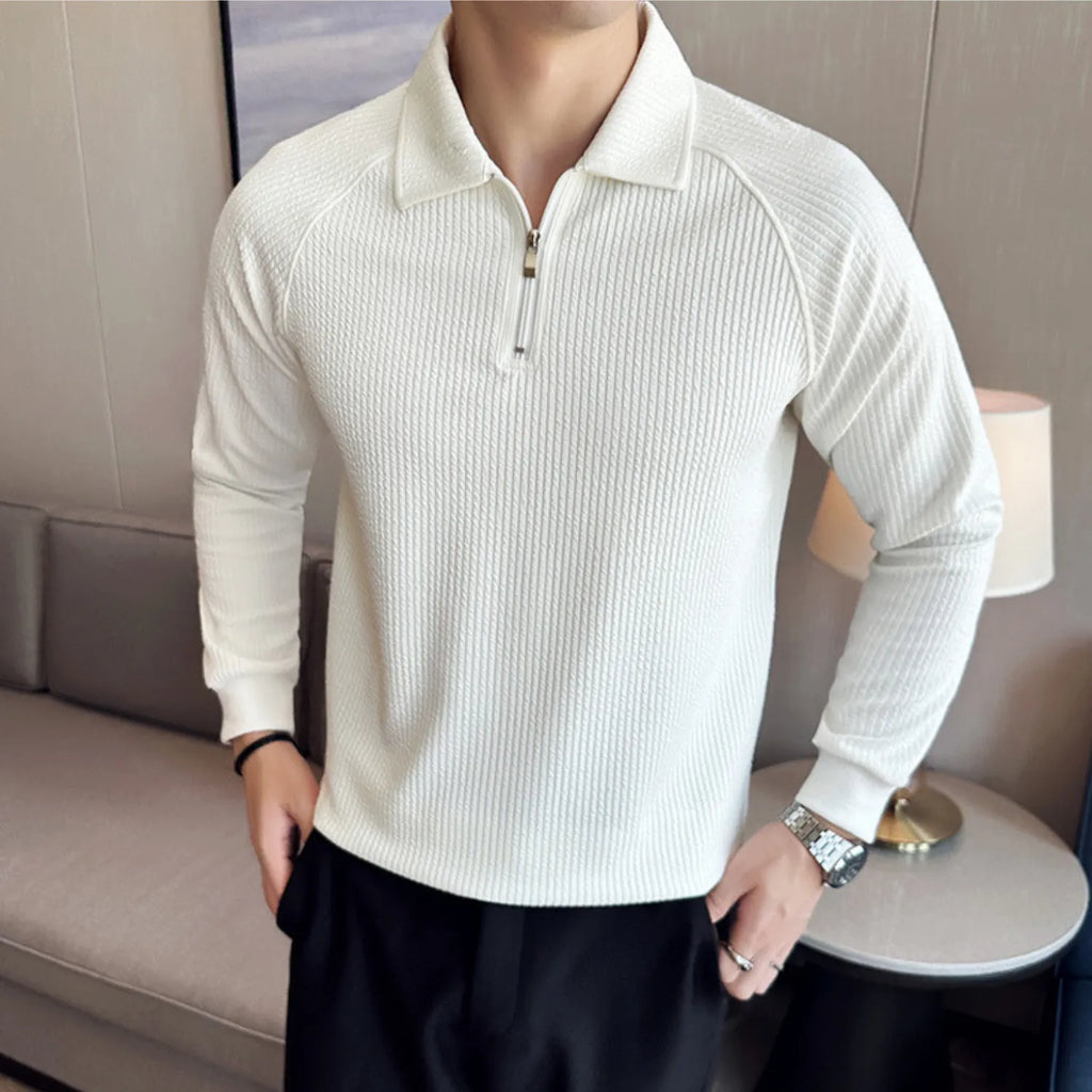 Model wearing Baltere's Men's Half-Zip Polo Shirt, showcasing its high-elastic seersucker texture and polo collar in white.