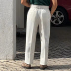 Rear view of the Baltere Men's High-Waisted Pleated Trousers, showcasing the sophisticated fit and classic waist details.