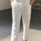 Detailed view of the Baltere Men's High-Waisted Pleated Trousers, highlighting the classic pleat and elegant, fluid drape.
