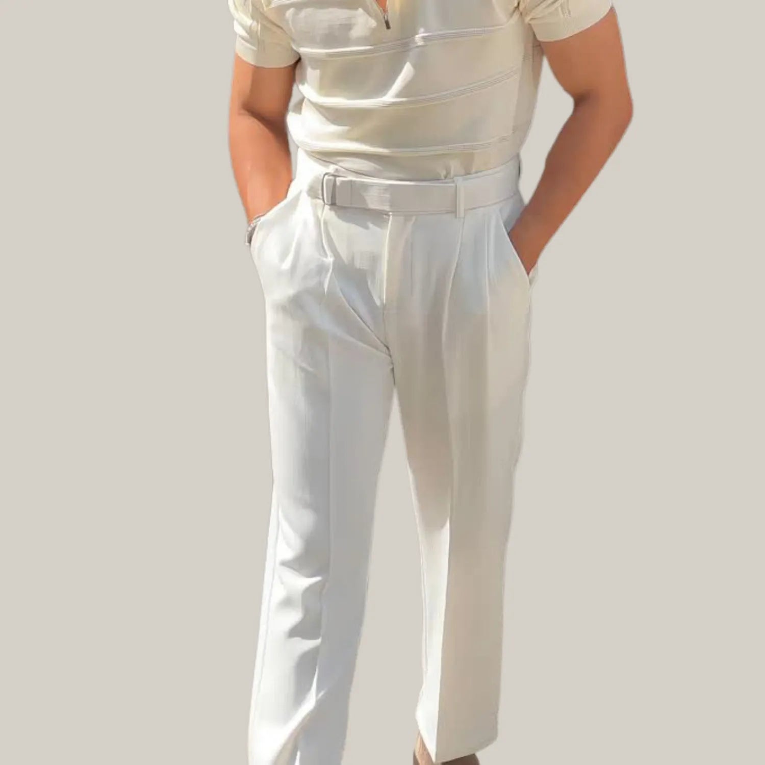 Model wearing Baltere's Men's High-Waisted Pleated Trousers, showcasing the elegant fit in white.