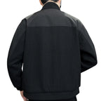 Rear view of the men's knitted coat, showcasing the unique ribbed texture and colour-block design.