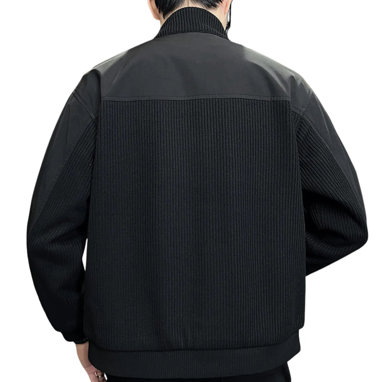 Rear view of the men's knitted coat, showcasing the unique ribbed texture and colour-block design.