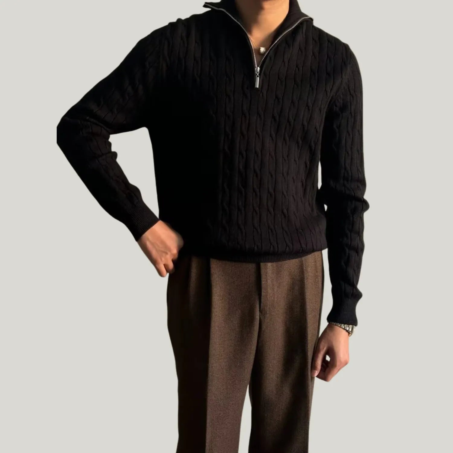 Model wearing Baltere's Men's Retro Pullover Sweater, showcasing its loose fit, knit texture, and comfortable style in black.