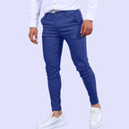 Model wearing Baltere's Men's Slim Fit Business Trousers, showcasing the modern tapered leg and versatile business-casual style in blue.