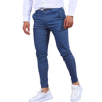 Model wearing Baltere's Men's Slim Fit Business Trousers, showcasing the modern tapered leg and versatile business-casual style in dark blue.