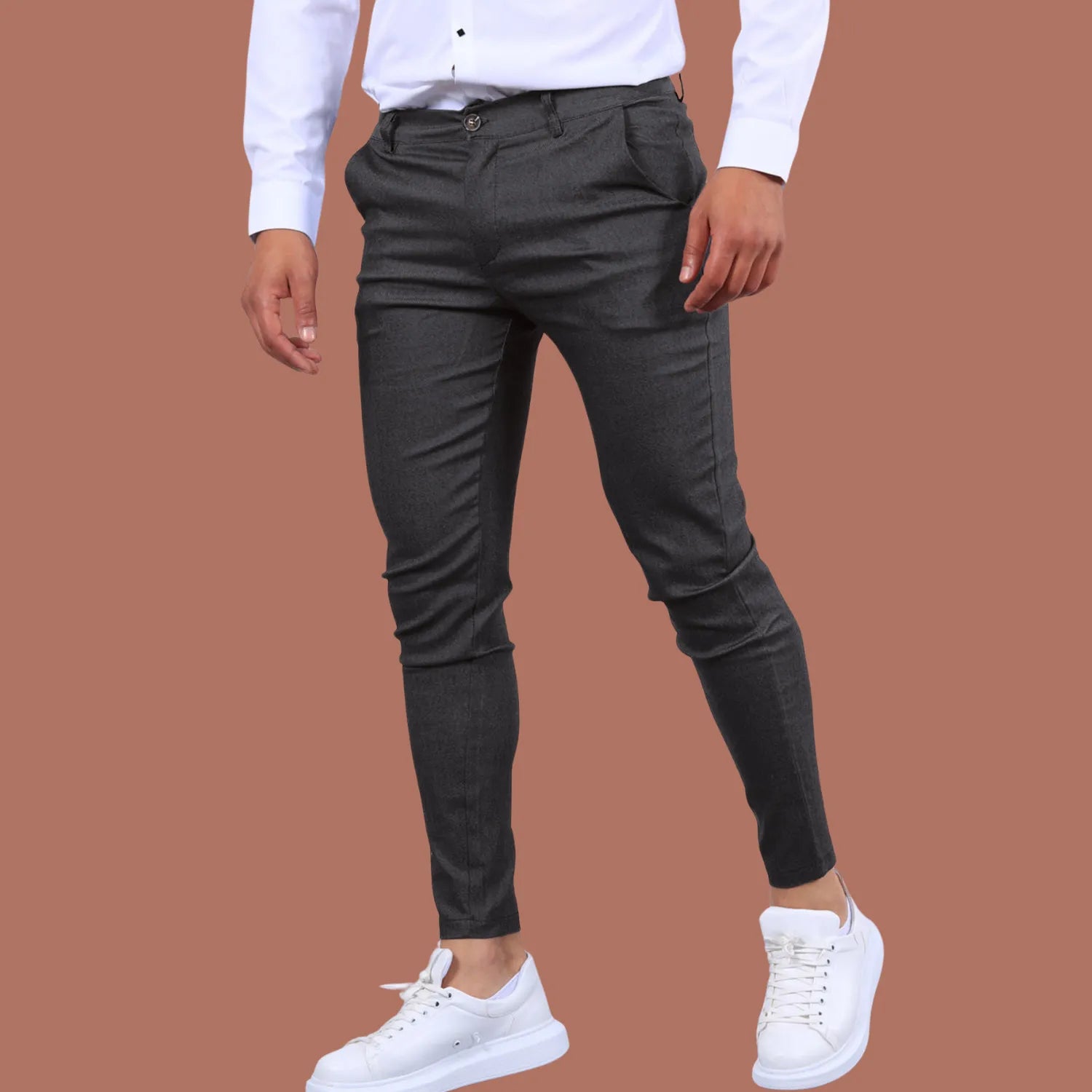 Model wearing Baltere's Men's Slim Fit Business Trousers, showcasing the modern tapered leg and versatile business-casual style in dark gray.