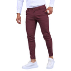 Model wearing Baltere's Men's Slim Fit Business Trousers, showcasing the modern tapered leg and versatile business-casual style in wine.