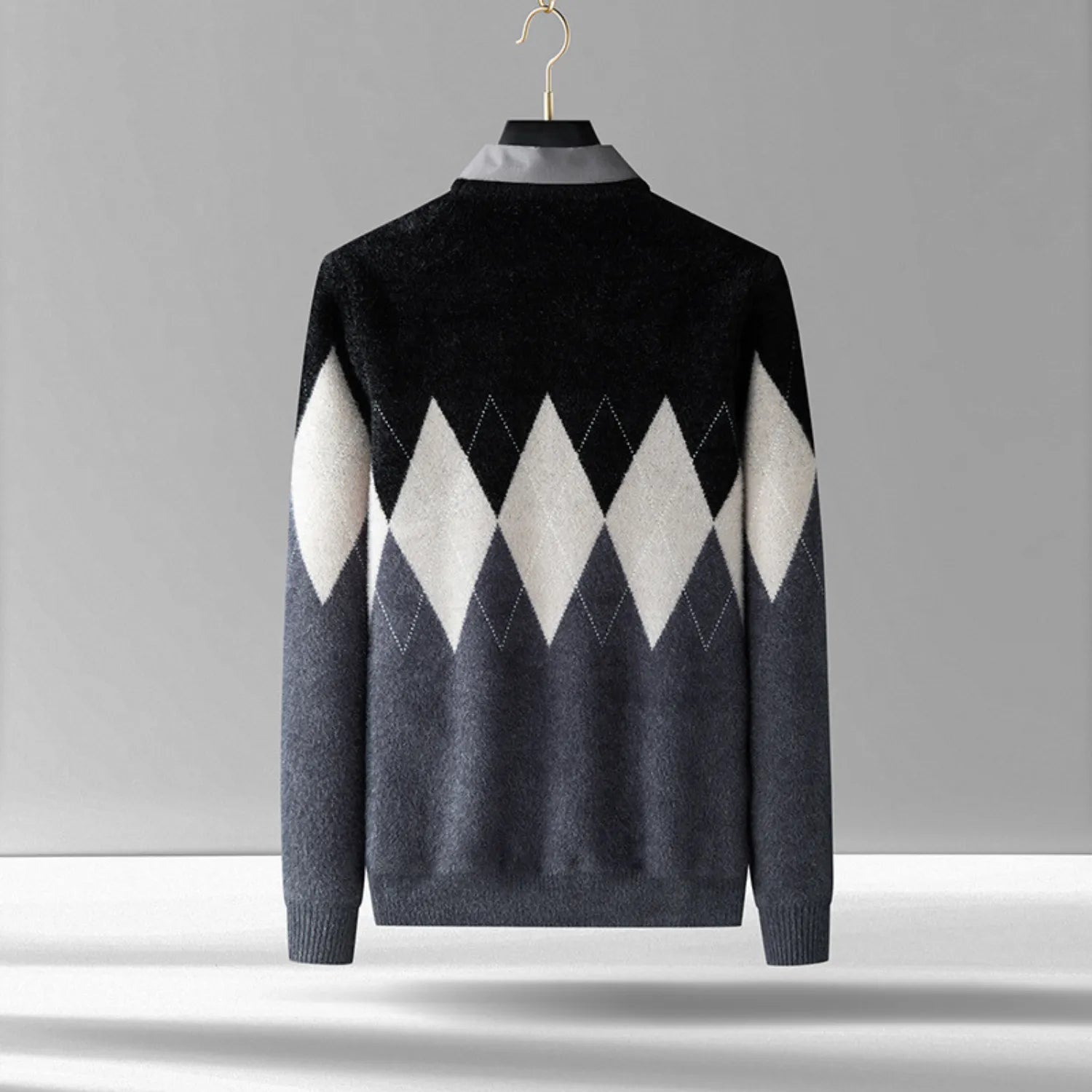 A rear view of the Men's Two-Piece Look Sweater, showcasing the bold diamond pattern and soft, textured fabric in gray.