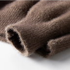 A detailed view of the men's sweater, showing the soft, plush texture of the knit fabric.