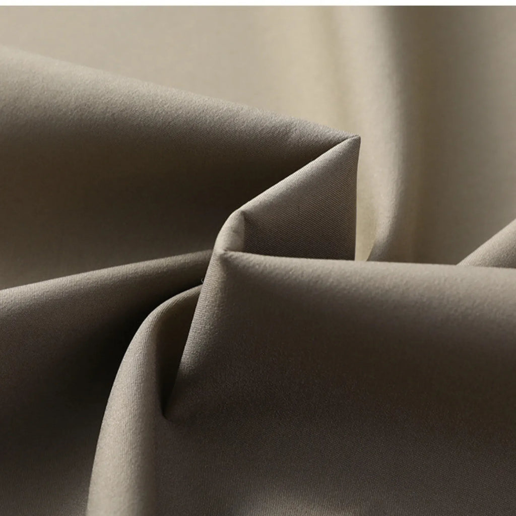 Close-up of the men's business casual jacket fabric, showing its smooth texture and elegant quality.