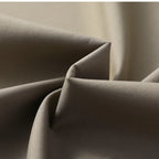 Close-up of the men's business casual jacket fabric, showing its smooth texture and elegant quality.