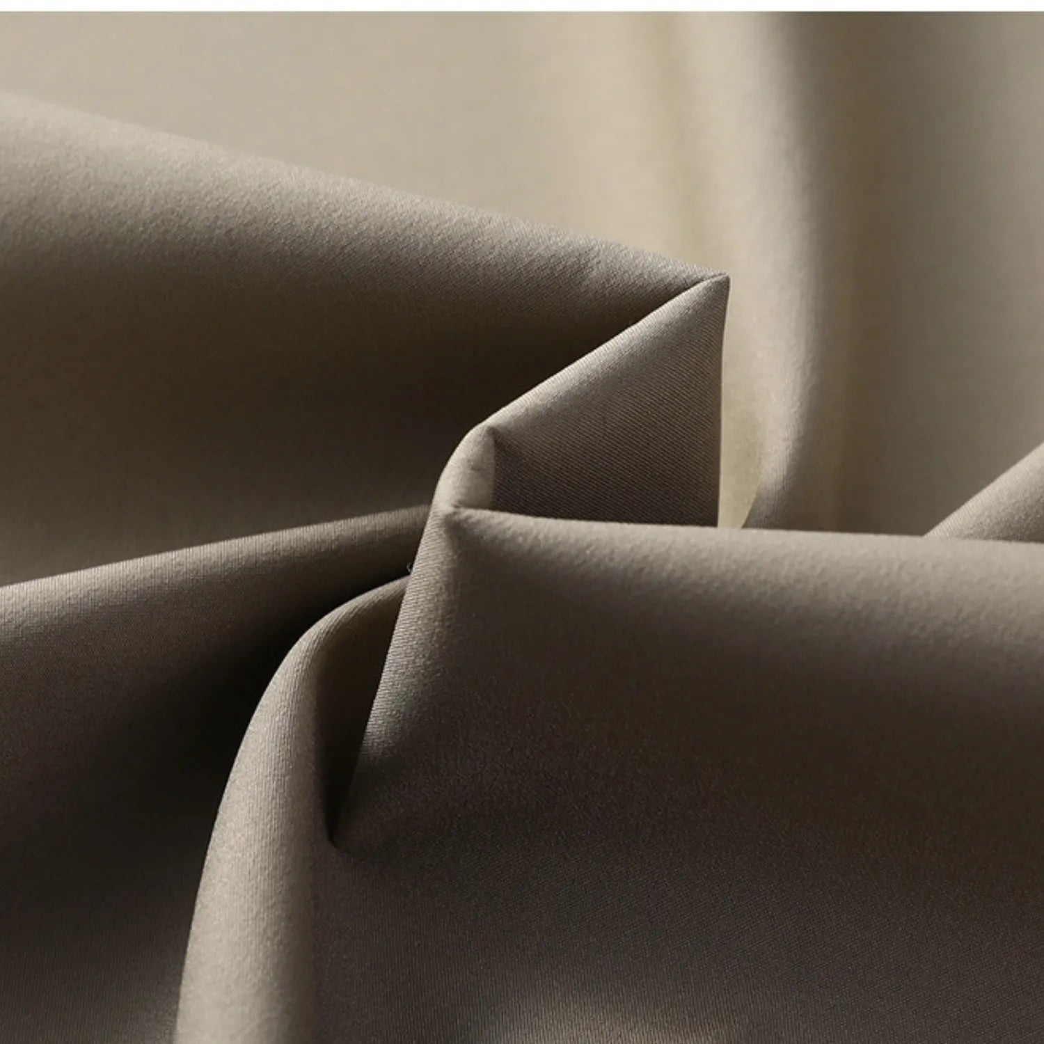 Close-up of the men's business casual jacket fabric, showing its smooth texture and elegant quality.