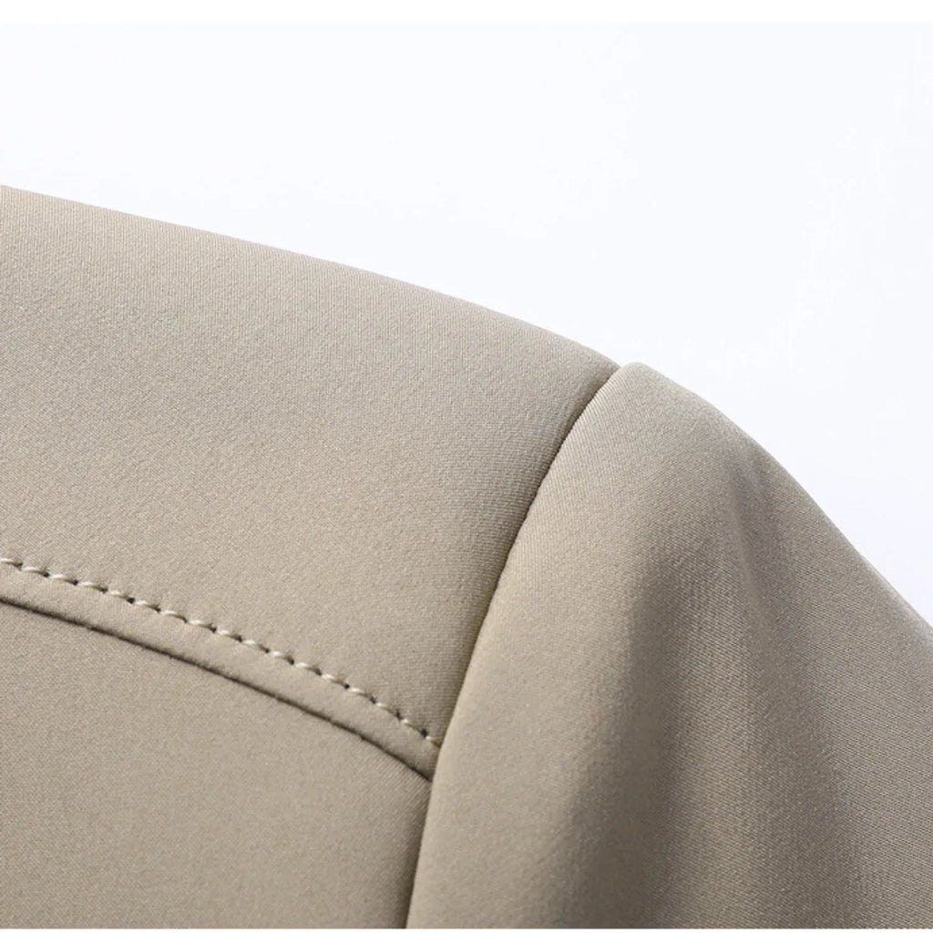 Close-up of the jacket's shoulder seam, showcasing the clean, tailored stitching and quality craftsmanship.