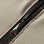 Close-up of the jacket's durable zipper, highlighting its quality hardware and sleek design.