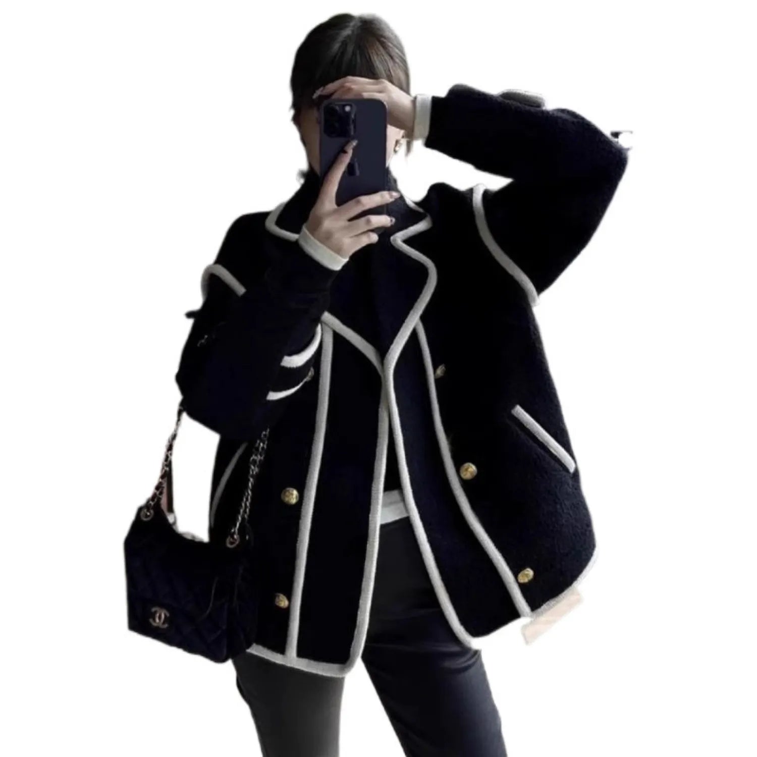 Model wearing Baltere's Retro Fleece Top black, showcasing its loose fit, and classic button details.