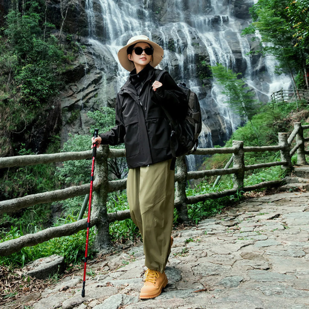 Model wearing Baltere's waterproof jacket black, made from high-quality polyester, emphasizing the tailored fit and performance features.