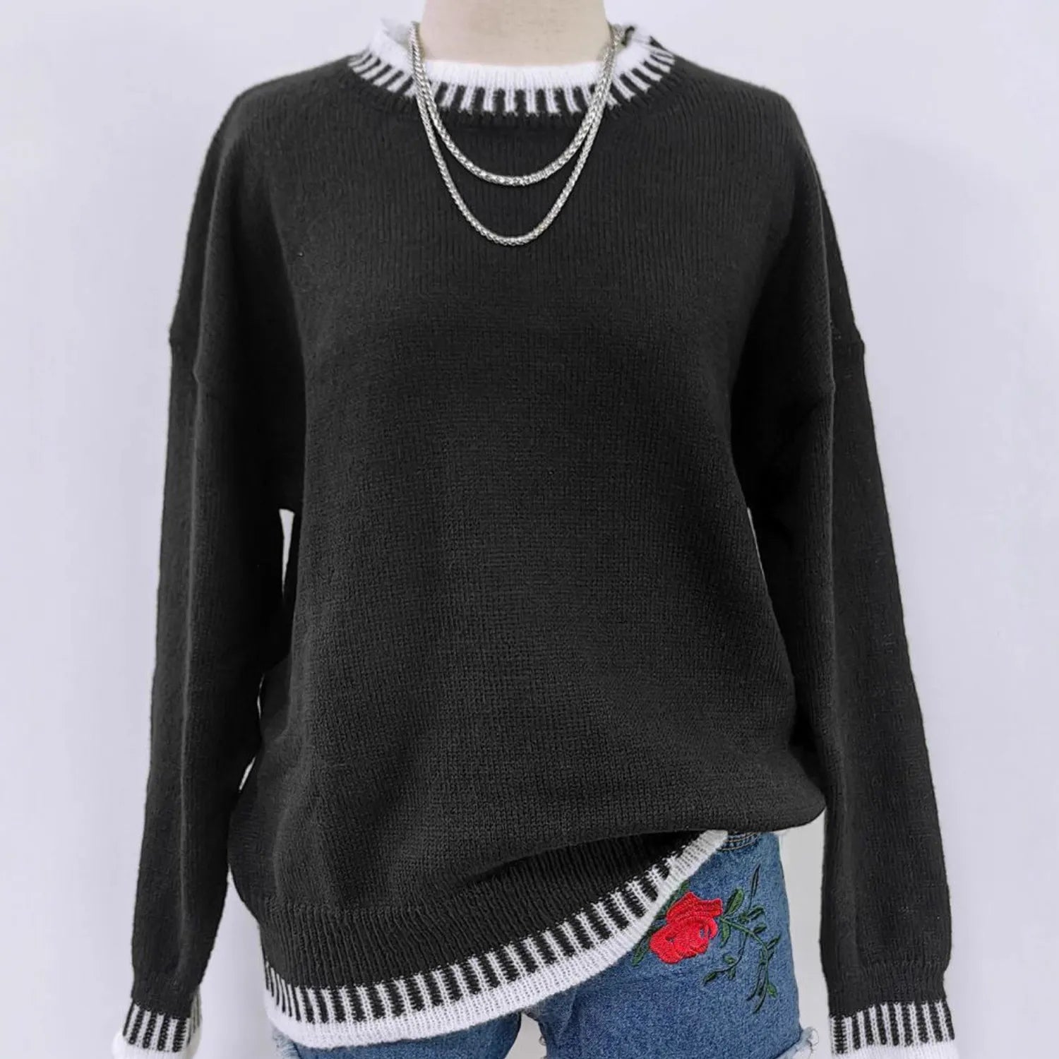 Model wearing Baltere's cozy sweater set, highlighting the long sleeves, relaxed fit, in black.