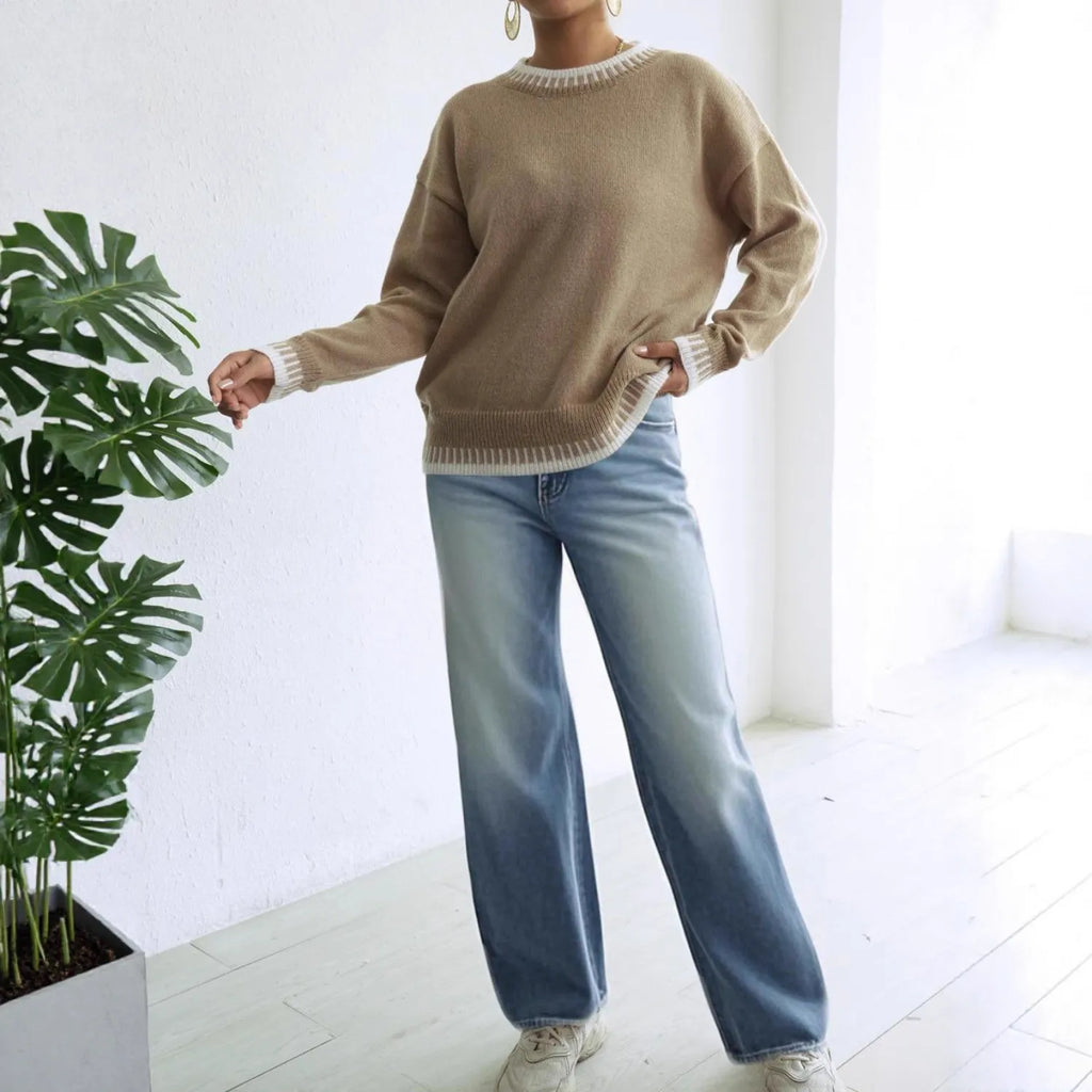 Model wearing Baltere's cozy sweater set, highlighting the long sleeves, relaxed fit, and modern contrasting color accents, in khaki.