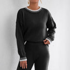 Baltere's Contrast Color Pullover Sweater black, showcasing the striking trim detail on the collar and cuffs, ideal for street style.