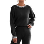 Model wearing Baltere's Contrast Color Pullover Sweater black, showcasing the striking trim detail on the collar and cuffs.