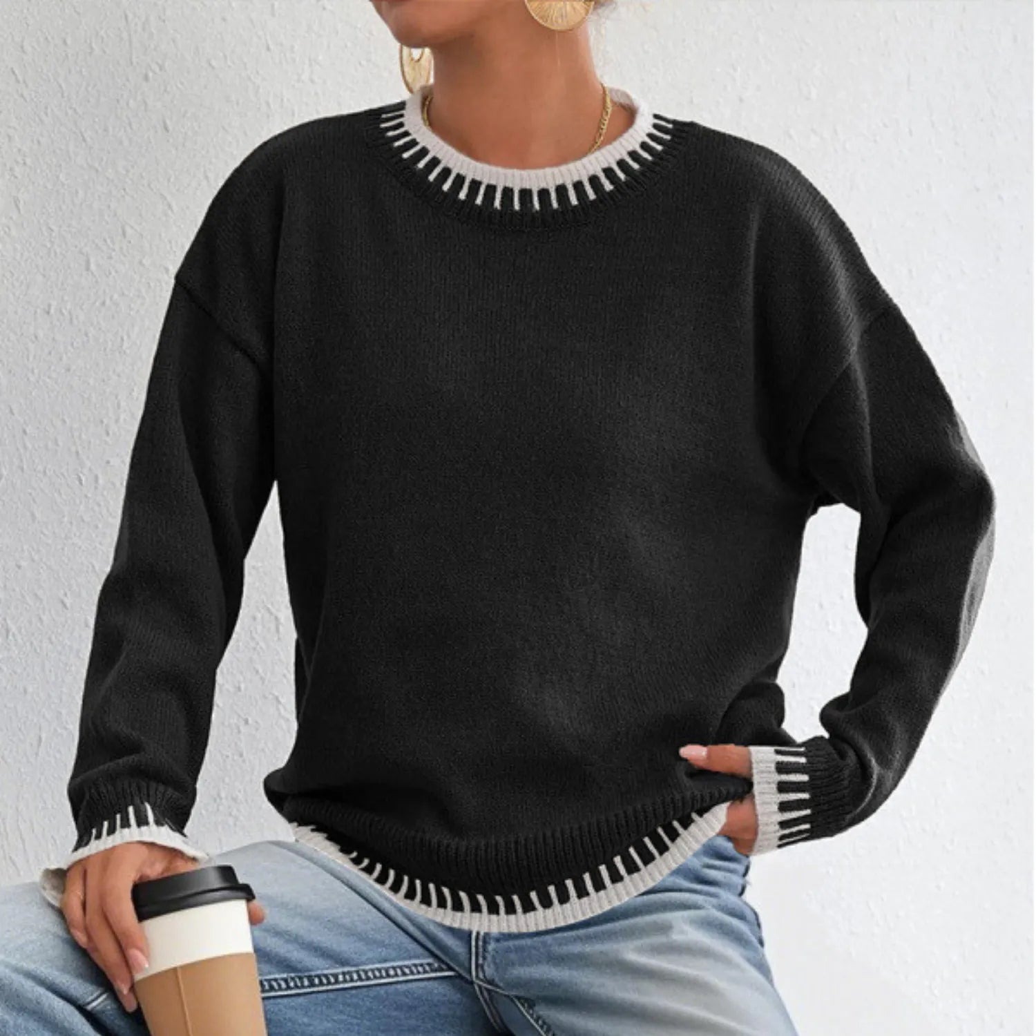 Model wearing the Women's Contrast Color Pullover Sweater, made from soft knitwear, emphasizing its comfortable fit and stylish detailing.