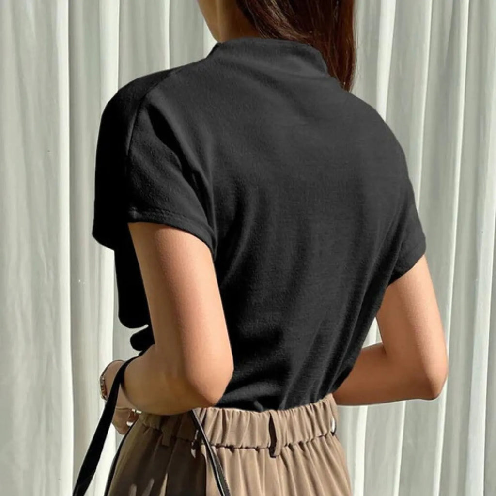 Rear view of the Women's Draping Pullover Top black, highlighting the sophisticated fabric drape and short sleeves.