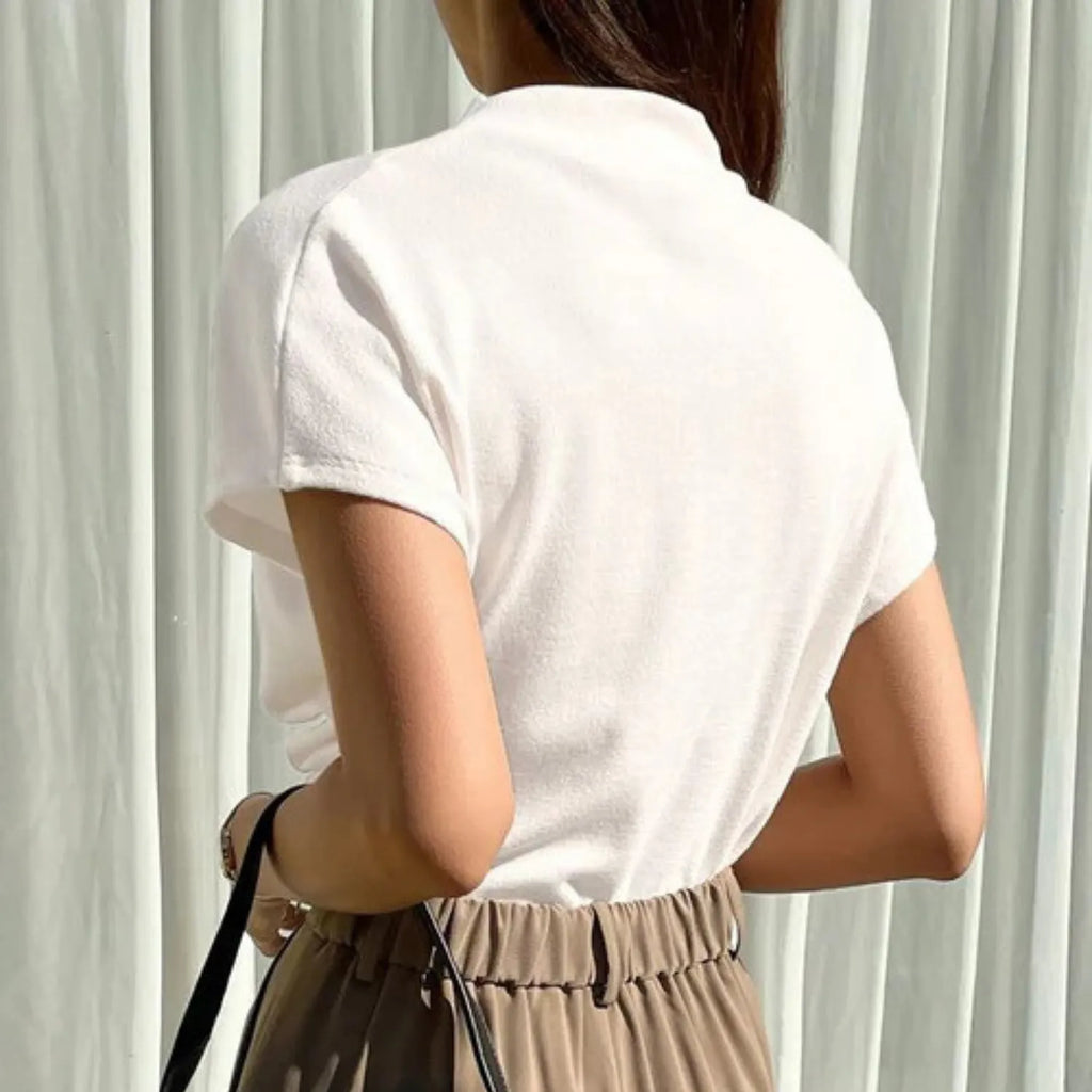 Rear view of the Women's Draping Pullover Top white, highlighting the sophisticated fabric drape and short sleeves.
