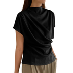 Model wearing Baltere's Draping Short Sleeve Pullover Top black, showcasing the elegant cowl neckline and relaxed fit.