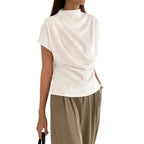 Model wearing Baltere's Draping Short Sleeve Pullover Top white, relaxed fit.