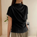 Baltere's Draping Short Sleeve Pullover Top black, showcasing the elegant cowl neckline and relaxed fit.