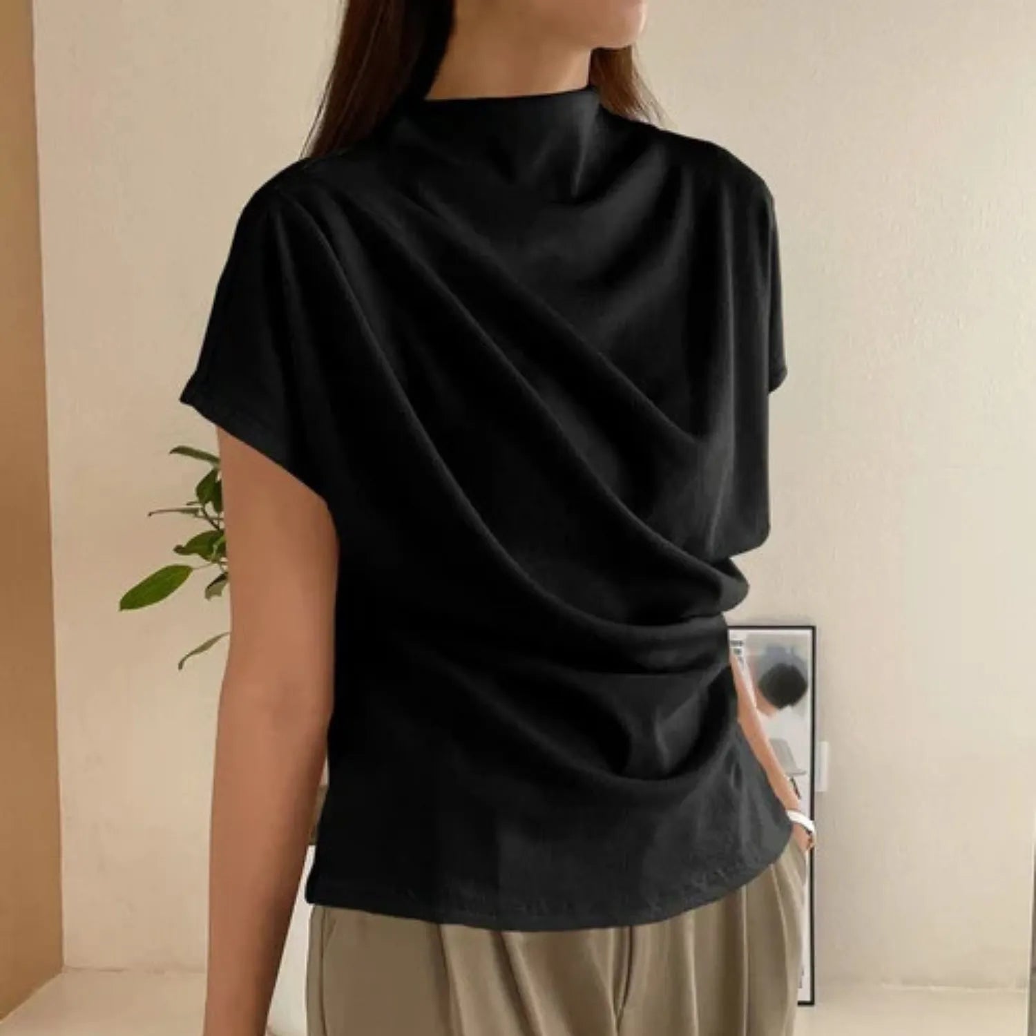 Baltere's Draping Short Sleeve Pullover Top black, showcasing the elegant cowl neckline and relaxed fit.