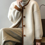 Detailed view of the women's East Asian Inspired Sherpa Coat, front buttons, and cozy faux fur texture.