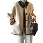 Baltere Women's East Asian Inspired Sherpa Coat, featuring a cozy faux fur texture, round buttons, and contrasting trim.