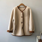 Baltere Women's East Asian Inspired Sherpa Coat, featuring a cozy faux fur texture, round buttons, and contrasting trim in mocha.