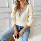 Model wearing the Baltere Lace Detail Sweater, emphasizing its relaxed fit and feminine, in beige.