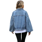 Model wearing Baltere's Women's Embossed Denim Jacket, showcasing its slim fit, button-up front, and casual style in blue.
