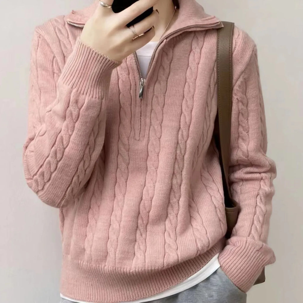 Model wearing Baltere's Women's High-Collar Zipper Pullover Top, showcasing its modern high-collar design and quarter-zip feature in pink.