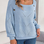 Baltere's cozy sweater light blue, highlighting the comfortable loose fit and decorative side buttons.