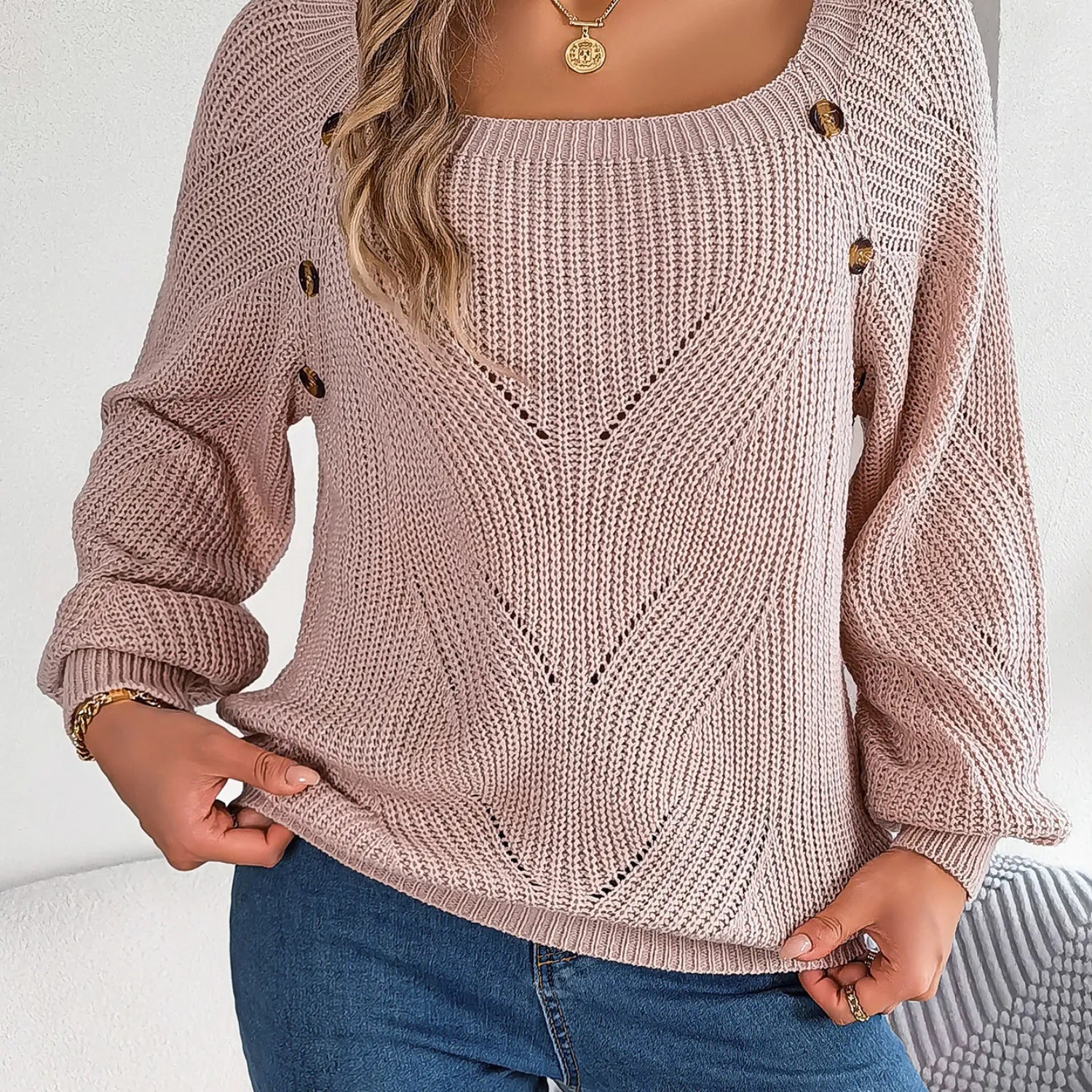 Model wearing Baltere's romantic Hollow-Out Lantern Sleeve Sweater, featuring a delicate knit, square neckline, and charming side buttons.