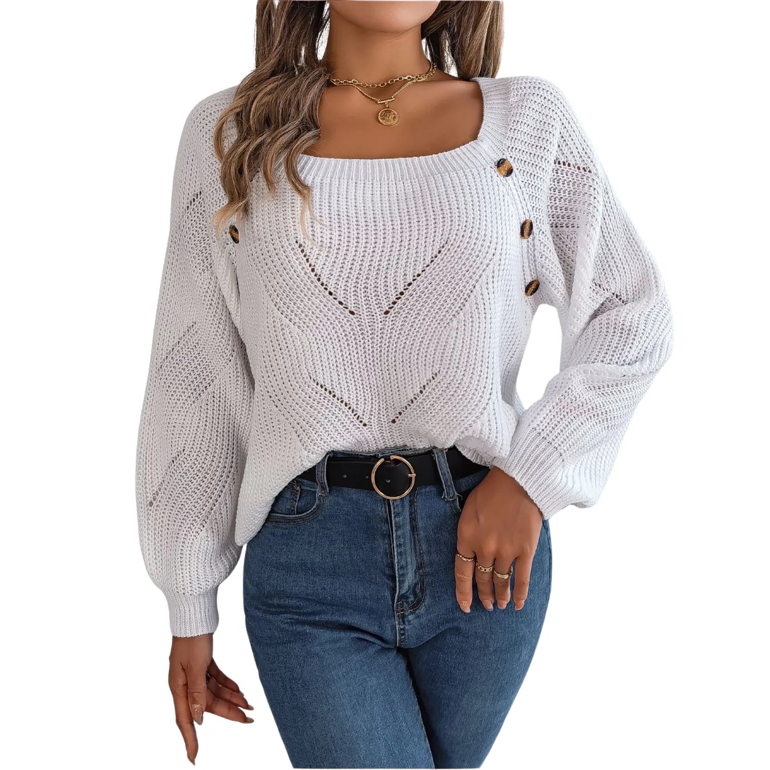 Model wearing Baltere's cozy sweater, highlighting the comfortable loose fit and decorative side buttons.