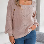 Model wearing the Women's Lantern Sleeve Sweater, featuring a fashionable wide neckline and delicate hollow-out knit detail, in pink.