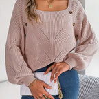 Model wearing Baltere's cozy sweater pink, highlighting the comfortable loose fit and decorative side buttons.
