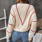 Back model wearing Baltere's Hollow Out Sweater, featuring a V-stripe pattern and a relaxed fit.