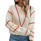 Model wearing Baltere's Hollow Out Sweater, featuring a V-stripe pattern and a relaxed fit in beige