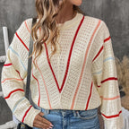 Model wearing Baltere's Hollow Out Sweater, featuring a V-stripe pattern, beige and a relaxed fit.
