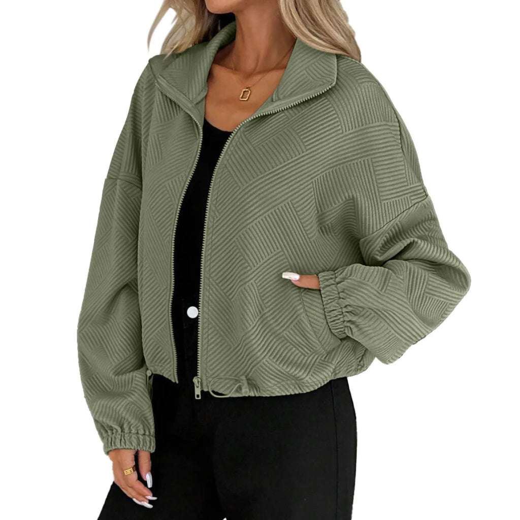 Model wearing the Baltere Baseball Uniform Coat army green, highlighting its casual street style, cropped length, and zippered pockets.